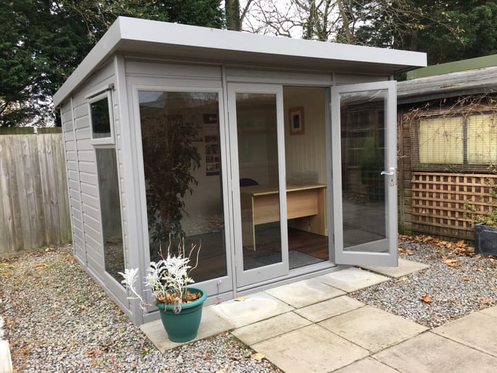 10ft x 8ft Studio Pent in Urban Grey optional painted finish. Other optional upgrades added to this building include; tinted glass windows, painted mdf lining and insulation and a deluxe laminate floor.