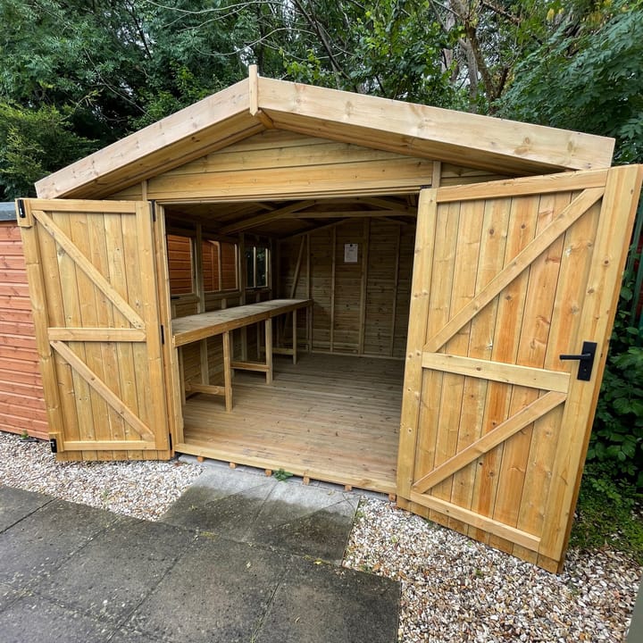 This 10ft x 12ft Malvern Heavy Duty Apex is constructed with heavy duty barnstyle cladding. Optional upgrades as shown include; double doors and a workbench. Ironmongery is available in chrome or as picture black.