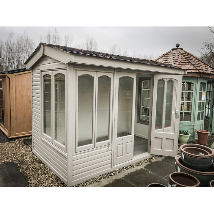This 10ft x 6ft Malvern Astwood summerhouse is painted in Vintage White colour finish. Optional laminate flooring has also been added.