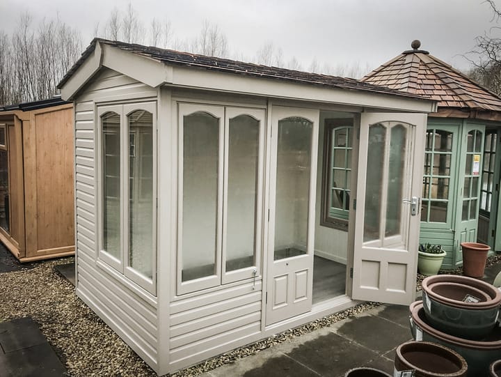 This 10ft x 6ft Malvern Astwood summerhouse is painted in Vintage White colour finish. Optional laminate flooring has also been added.
