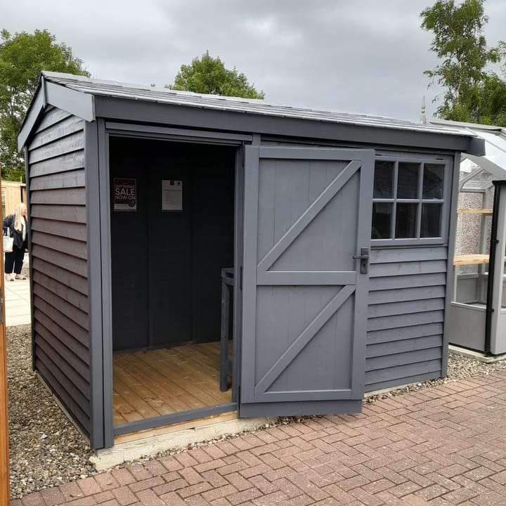 This 10ft x 6ft Heavy Duty Pavilion Apex is constructed in Heavy Duty Barnstyle cladding. A choice of door & window furniture is available in either chrome, or as pictured here black.

There are a number of optional upgrades pictured including; 'Graphite Grey' painted finish, slate effect roof, workbench and Georgian windows upgrade.