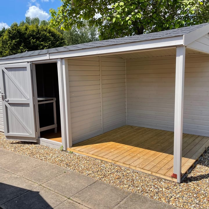 This 10ft x 8ft Heavy Duty Pavilion Apex is constructed in Heavy Duty Redwood cladding. A choice of door & window furniture is available in either black, or as pictured here chrome.

There are a number of optional upgrades pictured including; 'Fleet Grey' painted finish, felt tile roof and a workbench.

An optional 8ft wide Open area extension has also been added. A perfect sheltered area, large enough to fit a table and chairs or rattan furniture.