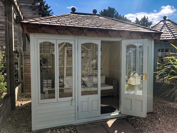 This 10ft x 8ft Malvern Ashton summerhouse is painted in Olive Grey colour. The building has also had laminate flooring added.
