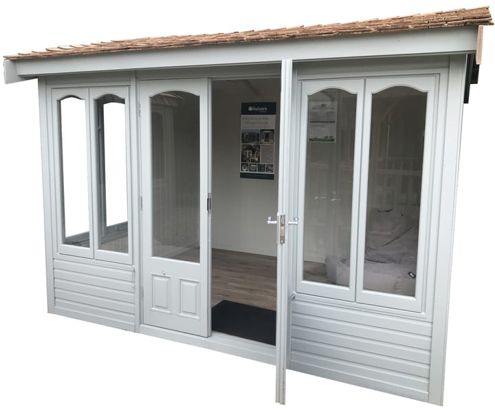Optional Olive Grey painted finish has been chosen for this 10ft x 8ft Malvern Astwood summerhouse. Also featured in this photo is the optional laminate floor upgrade, painted mdf lining, chrome upgrade and cedar shingle roof.