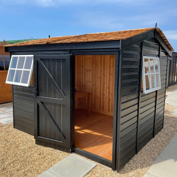 This 10ft x 8ft Heavy Duty Pavilion Apex is constructed in Heavy Duty Redwood cladding. A choice of door & window furniture is available in either chrome, or as pictured here black.

There are a number of optional upgrades pictured including; 'Black' painted finish, cedar shingle roof, tongue & groove lining & insulation and Georgian windows upgrade.