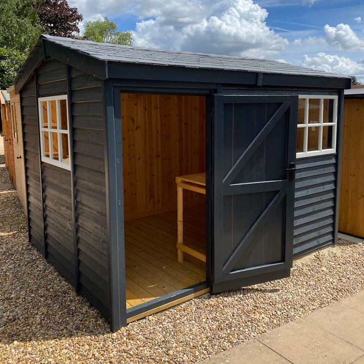 This 10ft x 8ft Heavy Duty Pavilion Apex is constructed in Heavy Duty Barnstyle cladding. A choice of door & window furniture is available in either chrome, or as pictured here black.

There are a number of optional upgrades pictured including; 'Squid Ink' painted finish, slate effect roof, tongue & groove lining & insulation, workbench and Georgian windows upgrade.