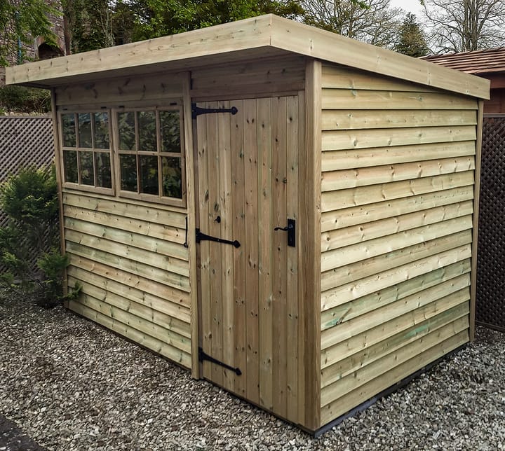 This 10ft x 8ft Heavy Duty Pent has been cladding with Heavy Duty Barnstyle timber. An effective pressure treated timber option, that is 23mm thick featheredge board. It is planed smooth on the inside of the shed and rough sawn on the outside, giving the timber that 'rustic' look.

For this building, the optional Georgian window upgrade has been chosen.