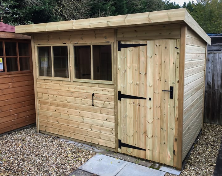 This 10ft x 8ft Heavy Duty Pent is manufactured in heavy duty pressure treated redwood. With the Heavy Duty Pent, you can choose to have the door in either end of the shed or, on the left hand side front - or, like this picture on the right hand side front.

You can also choose to have the door left hand hinged or right hand hinged,
