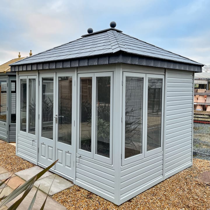 This 10ft x 8ft Ashton Summerhouse is has been finished with an exterior painted finish, Slate effect tile roof, Painted internal MDF Lining, Laminate floor and square top windows. 