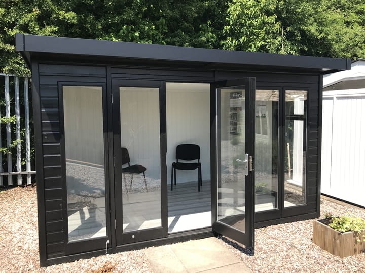 12ft x 8ft Malvern Studio Pent finished in optional Black painted colour. Optional laminate flooring, painted mdf lining and insulation have also been selected.