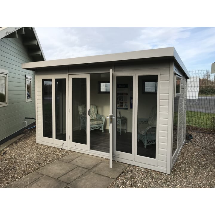 This 12ft x 8ft Studio Pent is painted in optional Fleet Grey colour. Optional tinted glass, painted mdf lining and insulation,  laminate flooring and privacy vent windows have also been selected 