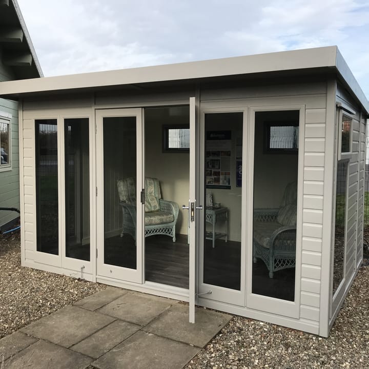'Fleet Grey' optional painted finish is a neutral colour choice, that blends in well with the majority of homes. It fits the contemporary style of this 12ft x 8ft Studio Pent, especially when paired with the optional tinted glass upgrade as this building has been.