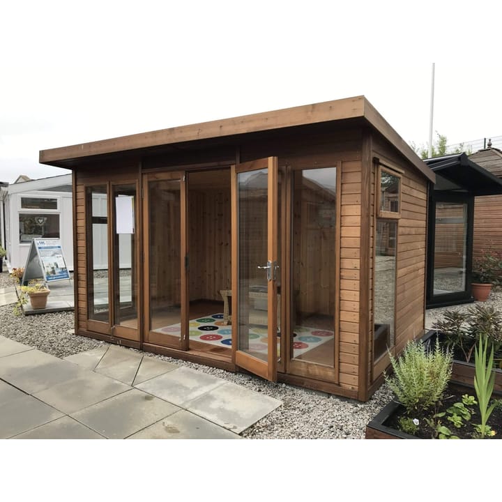 This 12ft x 8ft Studio Pent is constructed in Cedar cladding, one of 5 cladding options. Other cladding choices include redwood, pressure treated redwood, heavy duty redwood and heavy duty pressure treated redwood. 
Also pictured here is the optional tongue and groove lining and laminate floor