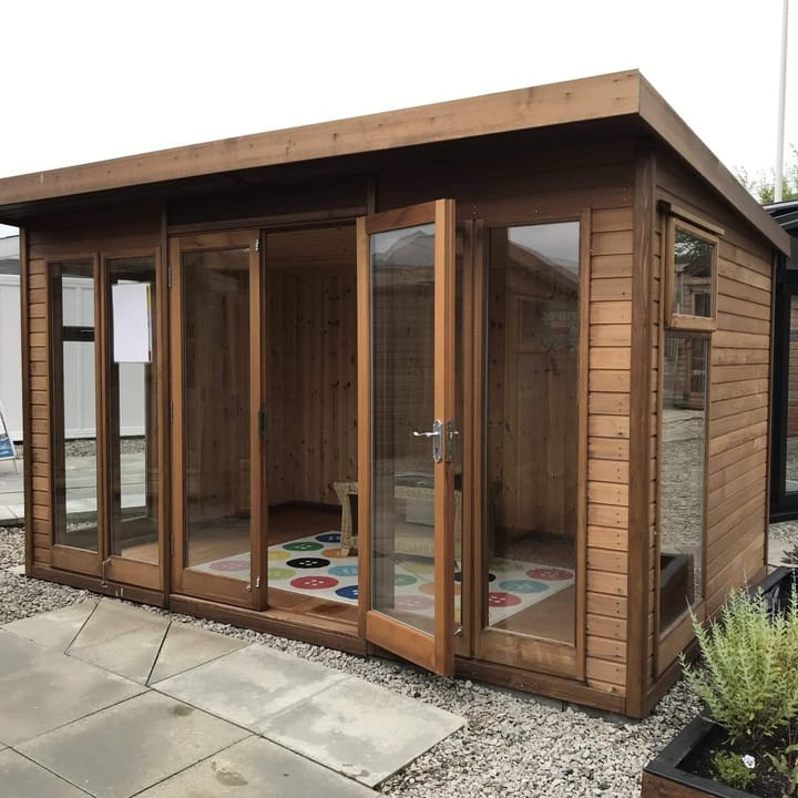This 12ft x 8ft Studio Pent is constructed in Cedar cladding, one of 5 cladding options. Other cladding choices include redwood, pressure treated redwood, heavy duty redwood and heavy duty pressure treated redwood. 
Also pictured here is the optional tongue and groove lining and laminate floor.

