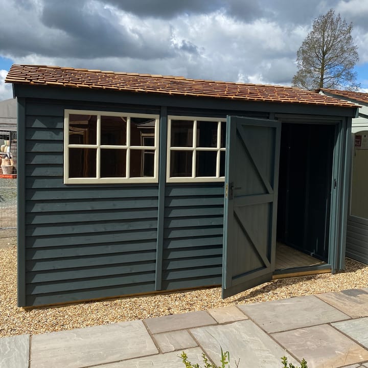This 12ft x 8ft Heavy Duty Pavilion Apex is constructed in Heavy Duty Barnstyle cladding. A choice of door & window furniture is available in either chrome, or as pictured here black.

There are a number of optional upgrades pictured including; 'Green Black' painted finish, cedar shingle roof and Georgian windows upgrade.