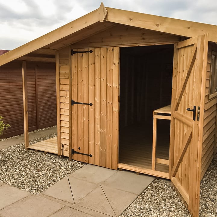 This 8ft x 12ft Heavy Duty Apex shed is constructed in Heavy Duty Barnstyle cladding. The shed has a number of optional upgrades including; a pressure treated slatted roof, double doors, a workbench to length and a 3ft logstore to the left hand side of the shed.