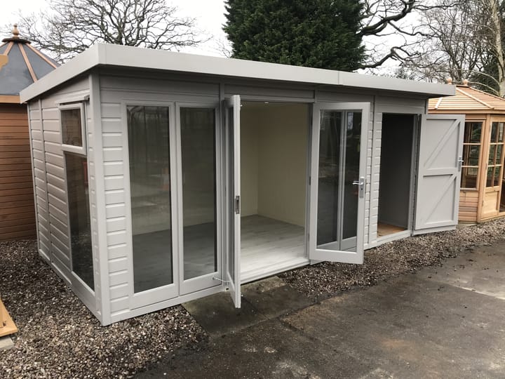 This 12ft x 8ft Studio Pent has a 4ft shed extension to the right hand end, meaning the overall size of this building is 16ft x 8ft. 'Fleet Grey' optional painted finish, tinted glass upgrade, laminate flooring and painted mdf lining and insulation round off the other upgrades added to this building.