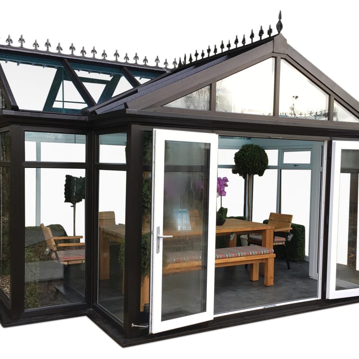 This 16ft 5in x 11ft 5in Oxfordshire Garden Room is finished in optional Black PVCu. Double opening doors, glass to ground glazing all-round and a polycarbonate roof are all standard features of the Oxfordshire. This Oxfordshire, has had the optional Deluxe glass roof upgrade and optional vinyl flooring.
