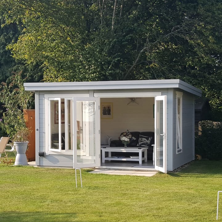 The Lillevilla Pent Log Cabin is a stylish and practical addition to any outdoor space, with its sturdy 44mm thick pine log construction and energy-efficient double glazing. Measuring 4m by 3m, this cabin is perfectly sized for a variety of uses, from a home office to a cozy retreat. It's topped with a durable EPDM roof, ensuring it stands strong against the elements while providing a modern silhouette against any garden backdrop.