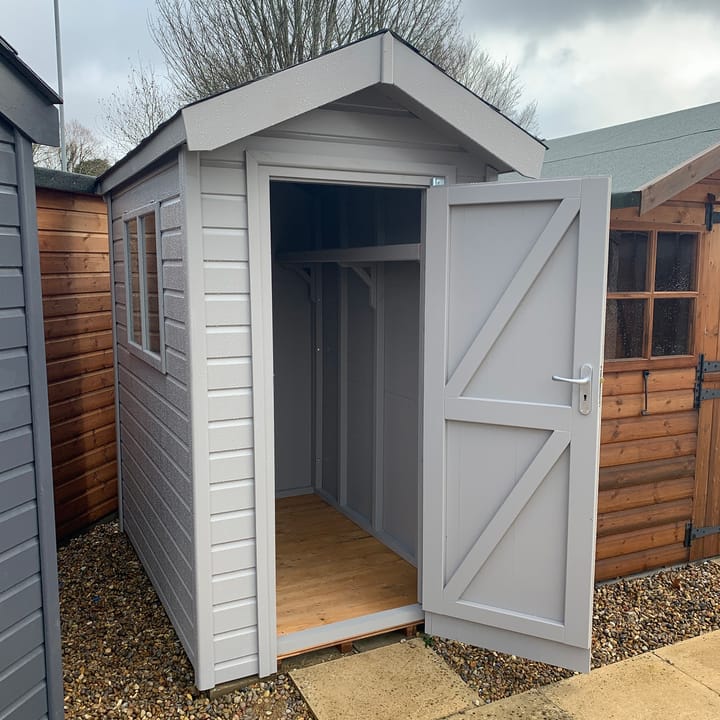 This 4ft x 6ft Heavy Duty Apex is constructed in heavy duty redwood cladding. A roof overhang and opening windows(s) are standard features as pictured. Ironmongery is available in a choice of black or as pictured here chrome. Optional extras shown here include a high level shelf, felt tile roof and a painted finish in 'Urban Grey'.