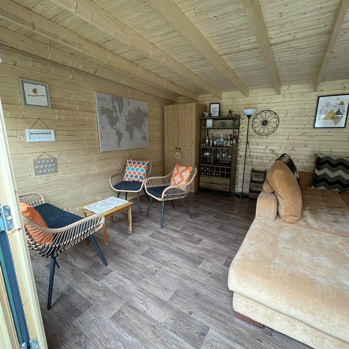 The uses of a Lillevilla Log Cabin are plentifold. Here this customer has used their 4m x 3m cabin as an additional lounge space.