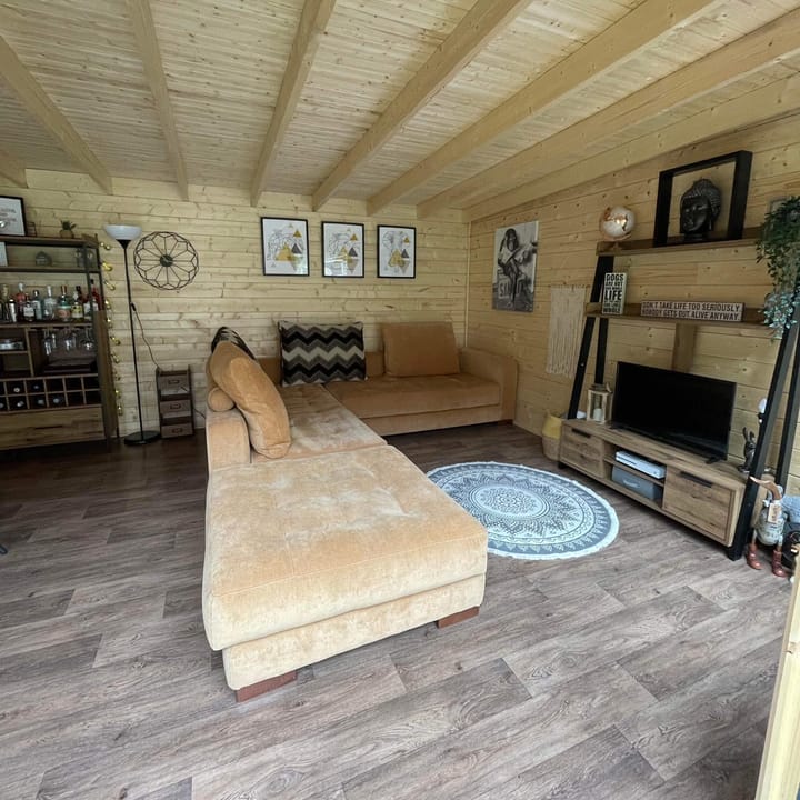 The uses of a Lillevilla Log Cabin are plentifold. Here this customer has used their 4m x 3m cabin as an additional lounge space.