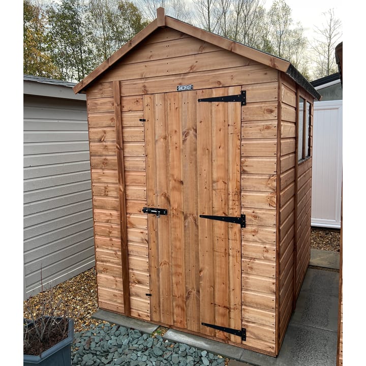 The Shedfast Apex shed is available in a range of sizes to suit all. 
Pictured here is the 5ft x 6ft model. The interchangeable windows and doors mean they can be positioned in any combination to suit your needs. The door is positioned in the gable end of this shed, but can easily be fitted to the side.

Black roofing felt is supplied as standard and the double pane windows are toughened safety glass with a pvc bottom cill.