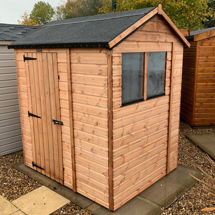 The Shedfast Apex shed is available in a range of sizes to suit all. 
Pictured here is the 5ft x 6ft model. The interchangeable windows and doors mean they can be positioned in any combination to suit your needs. The door is positioned in the side of this shed, but can easily be fitted to the gable end.

Black roofing felt is supplied as standard and the double pane windows are toughened safety glass with a pvc bottom cill.