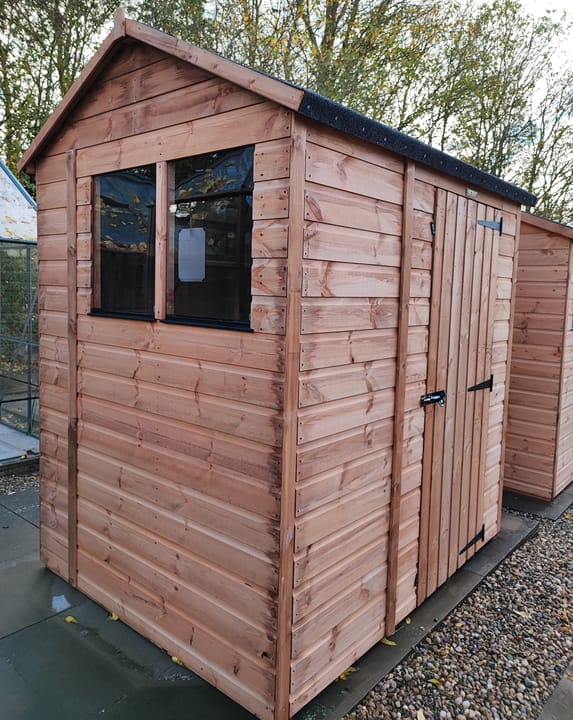 The Shedfast Apex shed is available in a range of sizes to suit all. 
Pictured here is the 5ft x 6ft model. The interchangeable windows and doors mean they can be positioned in any combination to suit your needs. The door is positioned in the gable end of this shed, but can easily be fitted to the side.

Black roofing felt is supplied as standard and the double pane windows are toughened safety glass with a pvc bottom cill.