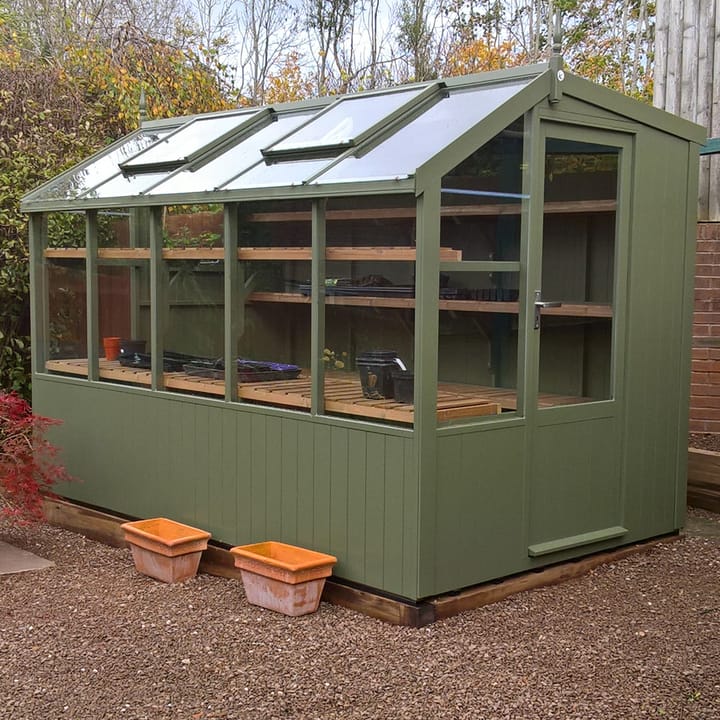 This 6ft x 10ft Swallow Jay greenhouse has the optional 'Bracken' painted finish. Optional additional high level shelving has been added to this greenhouse.