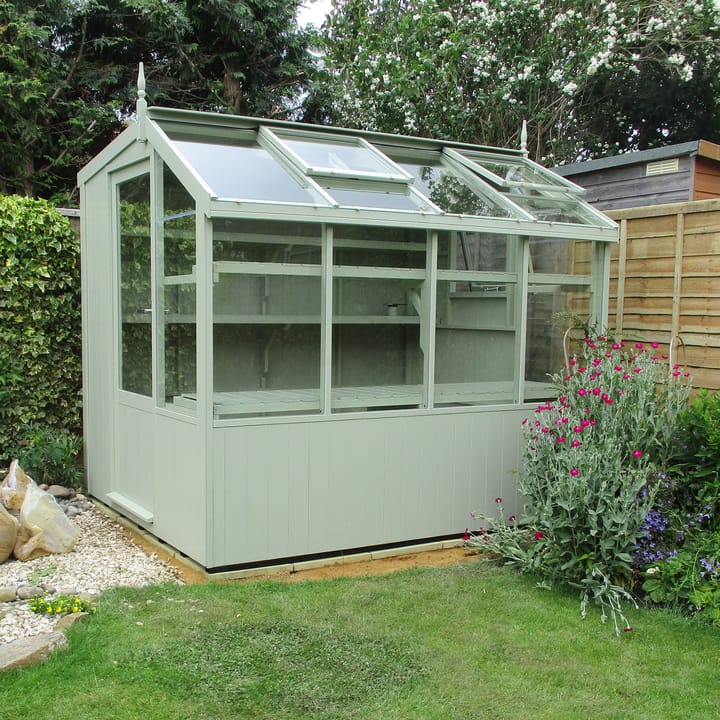 This 6ft x 8ft Swallow Jay greenhouse has the optional 'Vert De Terre' painted finish. Optional additional high level shelving has been added to this greenhouse.
