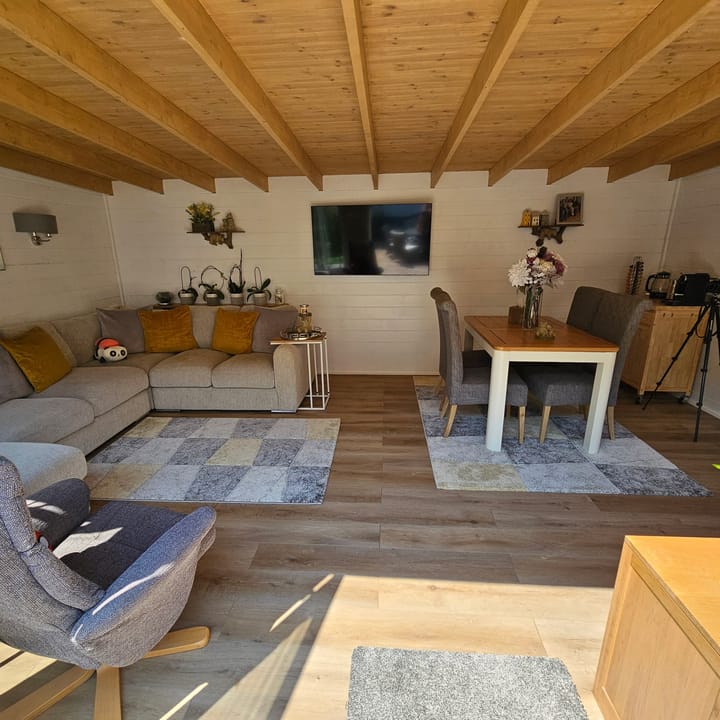 The uses of a Lillevilla Log Cabin are plentifold. Here this customer has used their 6m x 4m cabin as an additional home office and lounge space.