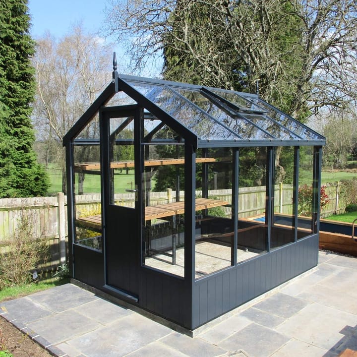 This 6ft x 8ft Swallow Kingfisher greenhouse has the optional 'Railings' painted finish. Optional high level shelving has been added to this greenhouse.