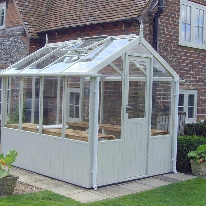 This 6ft x 8ft Swallow Kingfisher greenhouse has the optional 'Vert De Terre' painted finish. Optional extra staging and guttering have been added to this greenhouse.