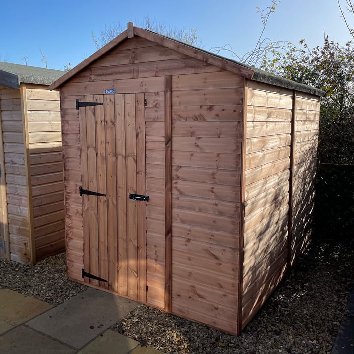 The Shedfast Apex shed is available in a range of sizes to suit all. 
Pictured here is the 6ft x 8ft model. The interchangeable windows and doors mean they can be positioned in any combination to suit your needs. The door is positioned in the gable end of this shed, but can easily be fitted on the side.

Black roofing felt is supplied as standard and the double pane windows are toughened safety glass with a pvc bottom cill.