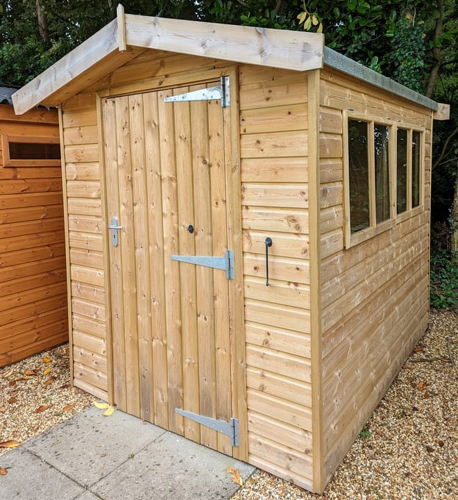 This 6ft x 8ft Heavy Duty Apex is constructed in heavy duty pressure treated redwood cladding. A roof overhang and opening windows(s) are standard features. Ironmongery is available in a choice of black or as pictured here chrome.