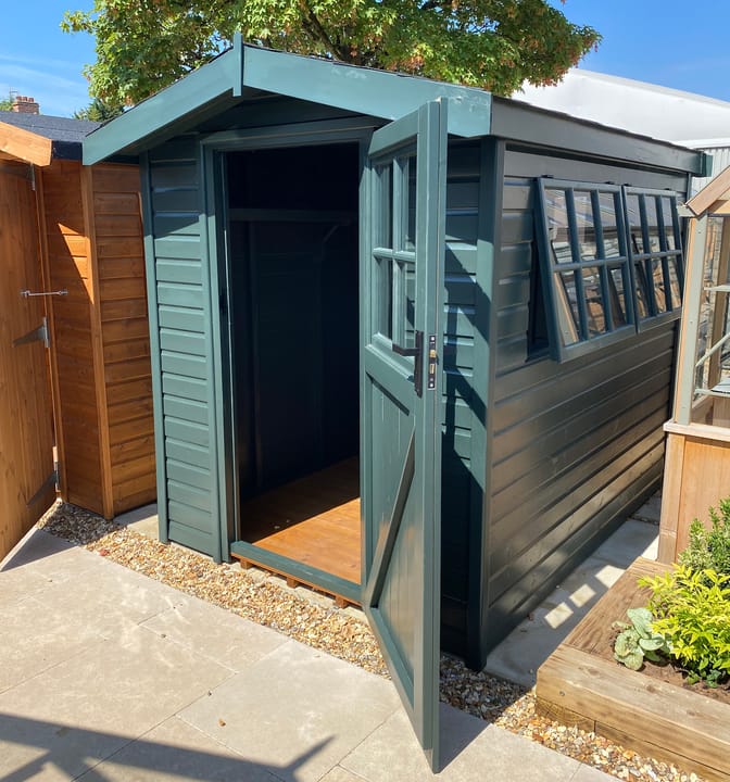 This 6ft x 8ft Heavy Duty Apex is constructed in Heavy Duty Redwood one of four timber options available with the Heavy Duty range, the other options being Heavy Duty Pressure Treated Redwood, Cedar and Heavy Duty Barnstyle cladding.
This Shed has had an optional painted finish in Green Black, as well as optional Georgian windows, Georgian window in the door, felt tiled roof, shelving and a workbench.
Optional installation available.