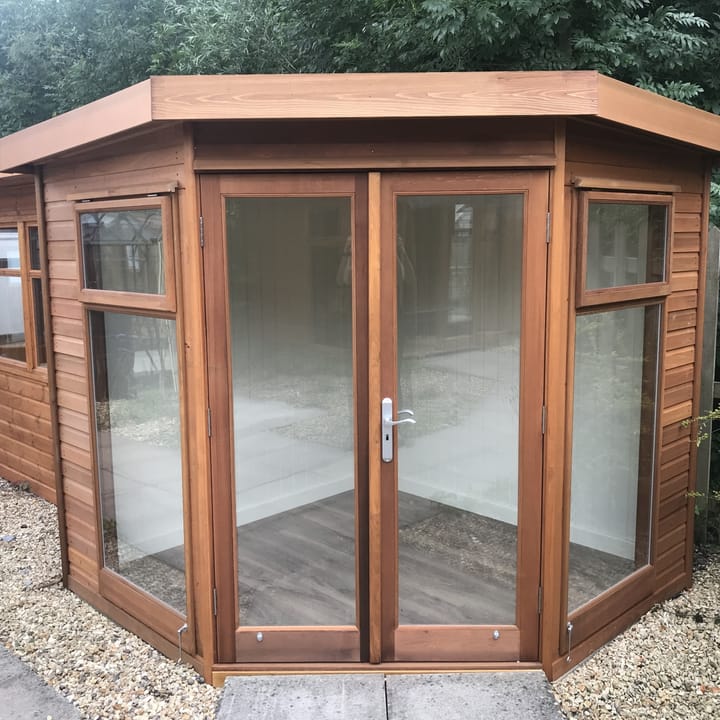 A 7ft x 7ft Studio Corner Pent looks stunning finished in Cedar cladding. The optional painted mdf lining and insulation and laminate flooring, really makes this garden room stand out.