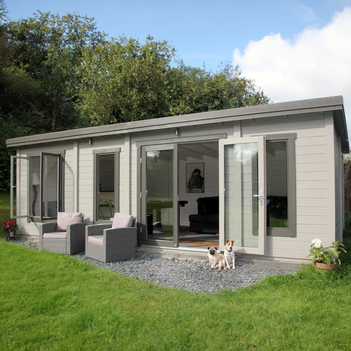 The Lillevilla Pent Log Cabin is a stylish and practical addition to any outdoor space, with its sturdy 44mm thick pine log construction and energy-efficient double glazing. Measuring 7.4m by 3m, this cabin is perfectly sized for a variety of uses, from a home office to a cozy retreat. It's topped with a durable EPDM roof, ensuring it stands strong against the elements while providing a modern silhouette against any garden backdrop.