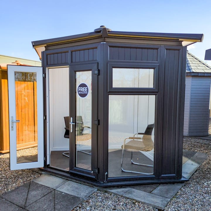This Nordic Ramsey Corner is the 2.4m x 2.4m model in optional Black finish with a hipped roof. Other optional upgrades for this building as shown are the tile effect roof and vinyl flooring.