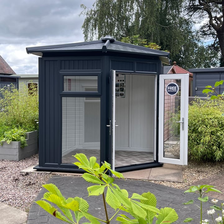 This Nordic Ramsey Corner is the 2.4m x 2.4m model in optional Grey finish with a hipped roof. Other optional upgrades for this building as shown are the tile effect roof and vinyl flooring.