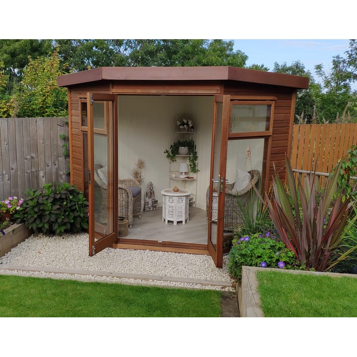 This 7ft x 7ft Studio Corner Pent looks stunning in this customers' garden. Cladded in cedar, this building has the optional painted mdf lining and insulation and laminate flooring.