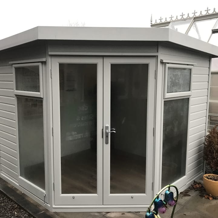 Redwood cladding has been used for this 8ft x 8ft Studio Corner Pent, which has also had the 'Dove Grey' optional painted finish. Optional laminate flooring and painted mdf lining & insulation are other additions to this building.
