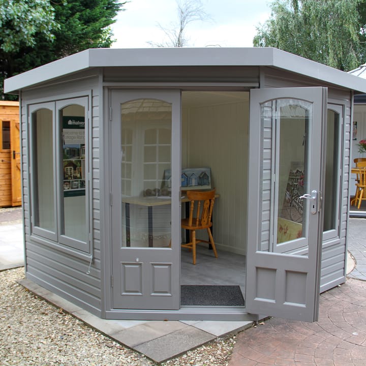 This 8ft x 8ft Harwood in Fleet Grey looks absolutely stunning. The 'cottage' style arched windows really add a decorative touch. Chrome has been chosen for the door and window furniture. 

One point worth knowing: If you opt for the double glazing upgrade, the arched top of the windows become square to accommodate the double glazed units.