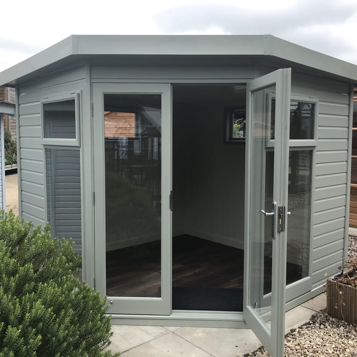 This Redwood 8ft x 8ft Studio Corner has the optional 'Olive Grey' painted finish. Other optional extras added to this building include the painted mdf lining and insulation, a laminate floor and 2 x privacy windows.