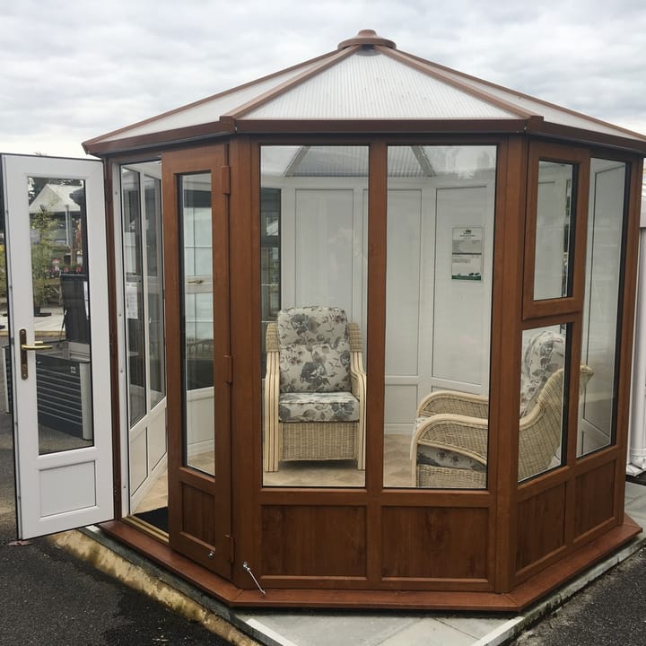 This 8ft 8in x 8ft 8in Sylt Pavilion is finished in Optional Golden Oak PVCu. Optional extras in the building as shown include; 3 x plain PVCu panels and vinyl flooring.