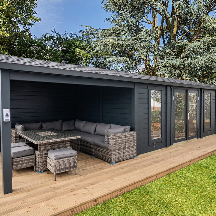 This image shows the Lillevilla Pavilion log cabin with Canopy 8m x 3m. The building includes a felt shingle roof and double glazed windows as standard.