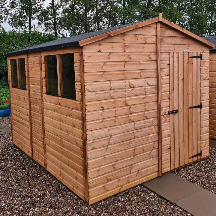 The Shedfast Apex shed is available in a range of sizes to suit all. 
Pictured here is the 8ft x 10ft model. The interchangeable windows and doors mean they can be positioned in any combination to suit your needs. The door is positioned in the gable end of this shed, but can easily be fitted to the side.

Black roofing felt is supplied as standard and the double pane windows are toughened safety glass with a pvc bottom cill.