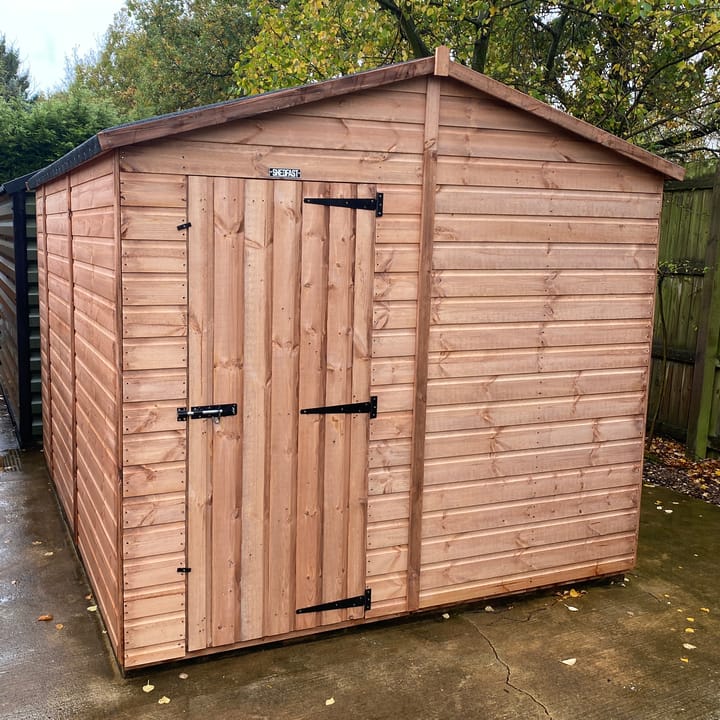 The Shedfast Apex shed is available in a range of sizes to suit all. 
Pictured here is the 8ft x 10ft model. The interchangeable windows and doors mean they can be positioned in any combination to suit your needs. The door is positioned in the gable end of this shed, but can easily be fitted to the side.

Black roofing felt is supplied as standard and the double pane windows are toughened safety glass with a pvc bottom cill.