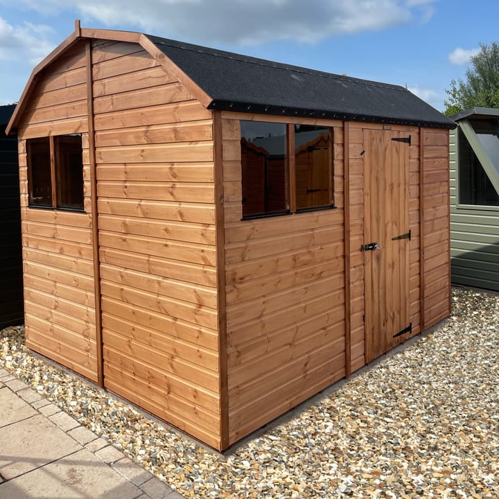 The Shedfast Dutch Barn shed is available in a range of sizes to suit all. 
Pictured here is the 8ft x 10ft model. The interchangeable windows and doors mean they can be positioned in any combination to suit your needs. The door is positioned on the side of this shed, but can easily be fitted in the gable end.

Black roofing felt is supplied as standard and the double pane windows are toughened safety glass with a pvc bottom cill.